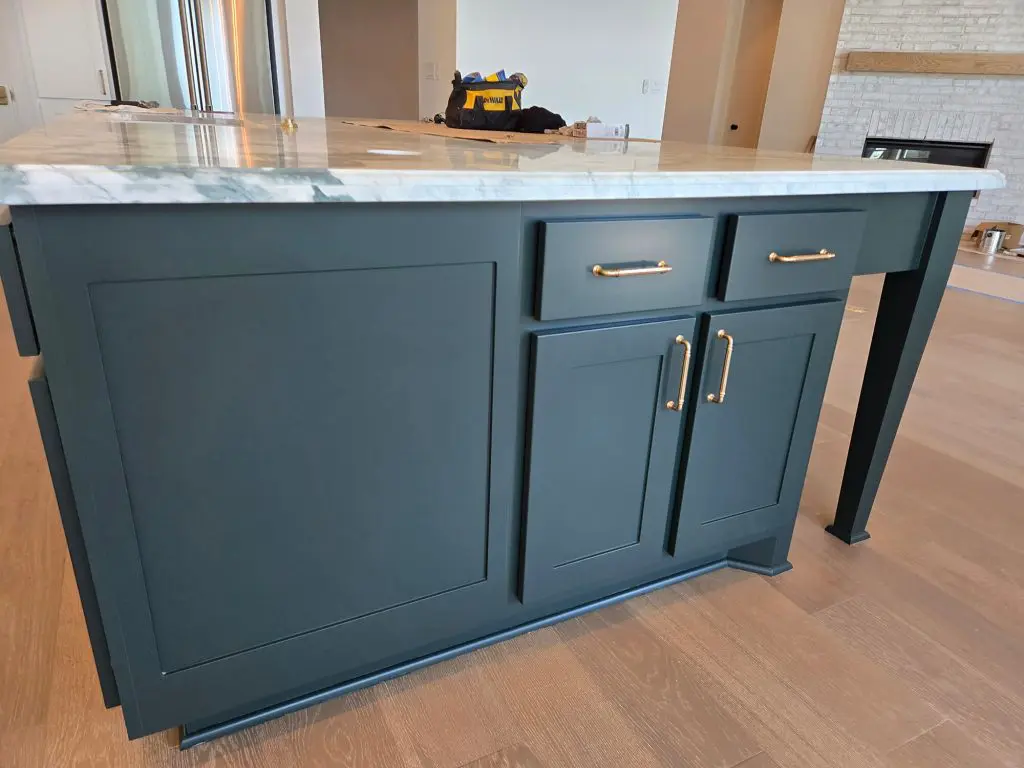 Built-in beverage bar with sophisticated matte black cabinetry, under-cabinet lighting, and a white marble top, completed flawlessly by Texas Star Painting of Austin.