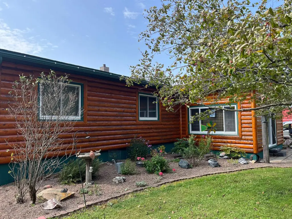 Three distinct views showcasing remarkable log home restoration and a dramatic underdeck lattice refresh by Texas Star Painting of Austin.